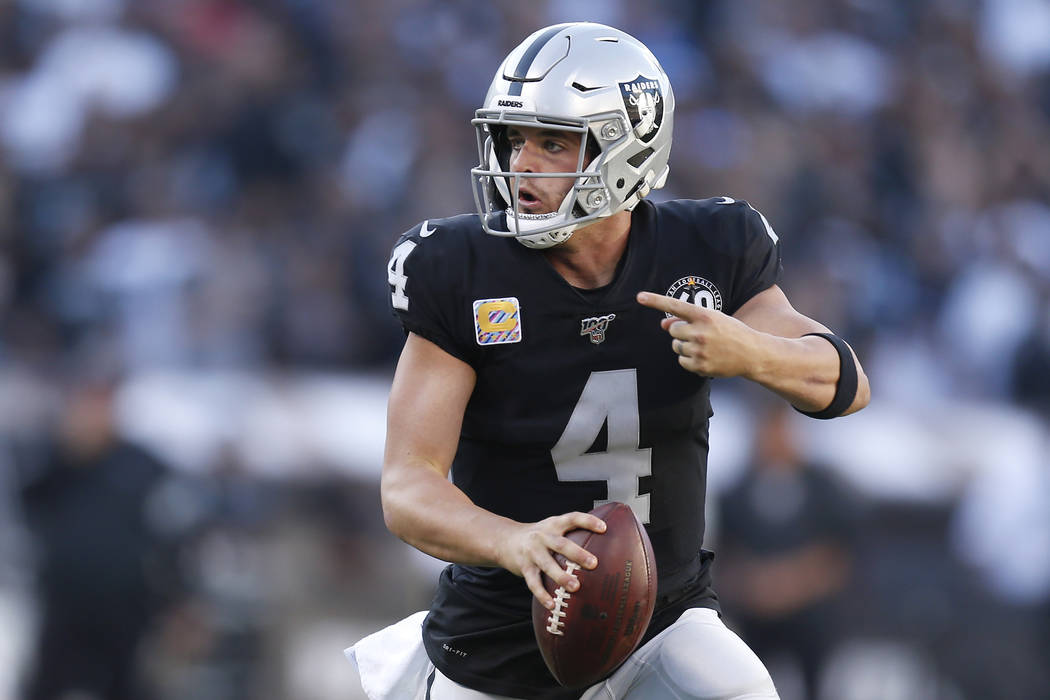 Oakland Raiders quarterback Derek Carr (4) scrambles against the Detroit Lions during the secon ...