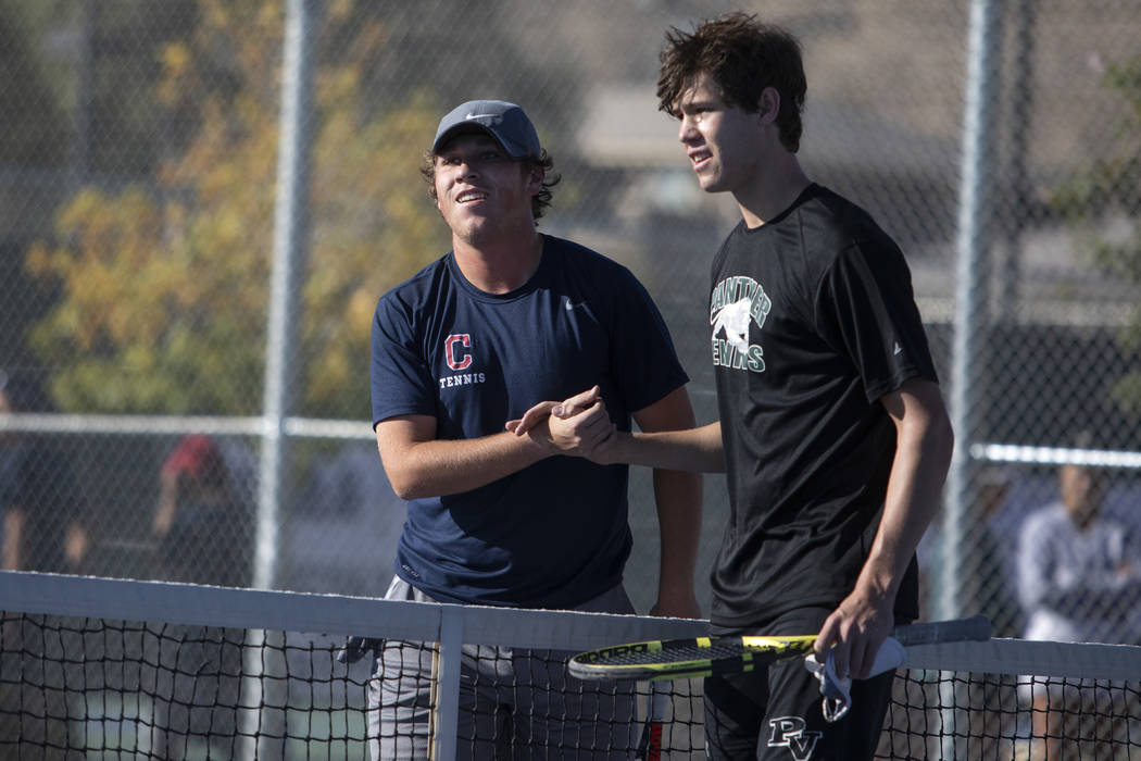 Palo Verde singles player Michael Andre shakes hands with Coronado's Tanner Phillips after winn ...