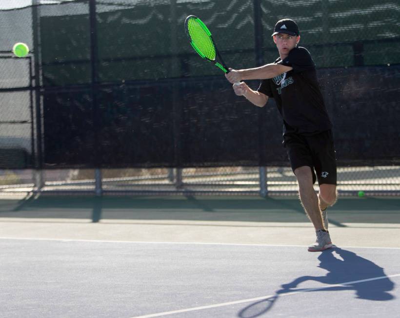 Palo Verde's Jack Kostrinsky whacks the ball to Coronado's Aiden Benoualid during a singles mat ...