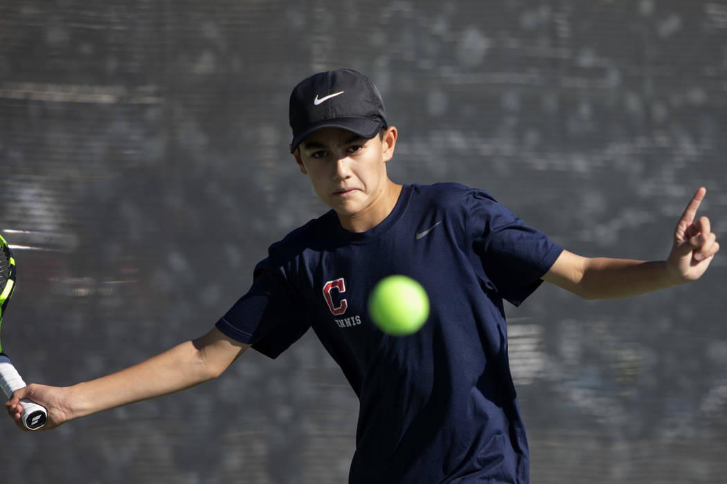 Coronado's Jack Wohlwend eyes the ball during a doubles match against Palo Verde High School on ...
