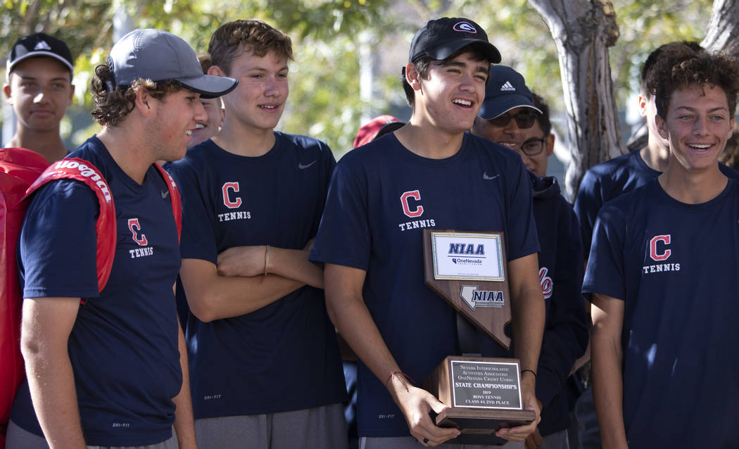 The Coronado High School varsity boys tennis team accepts their class 4A second place state cha ...