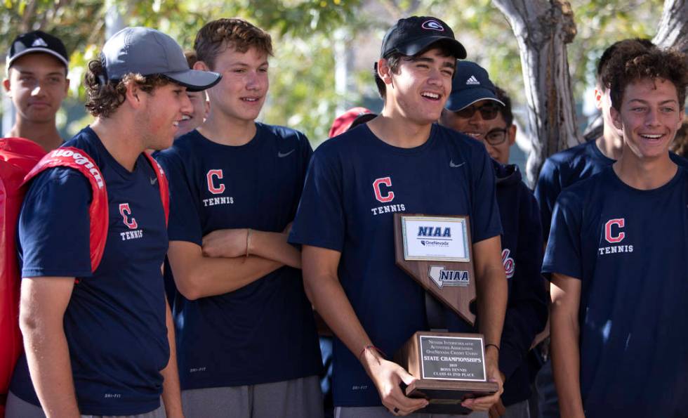 The Coronado High School varsity boys tennis team accepts their class 4A second place state cha ...