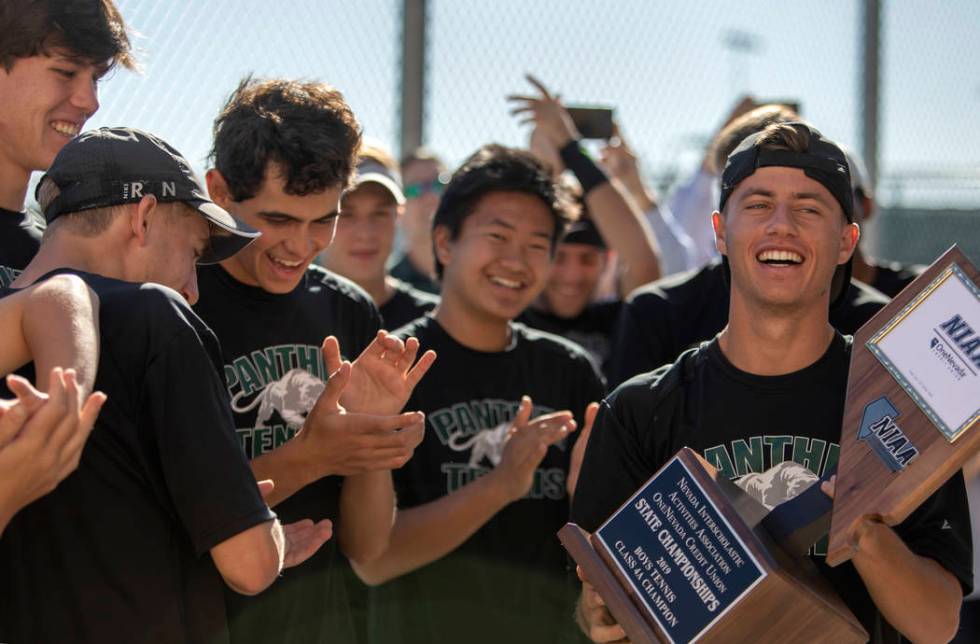 Palo Verde captain Jack Kostrinsky accepts the 4A varsity boys state championship trophy as his ...