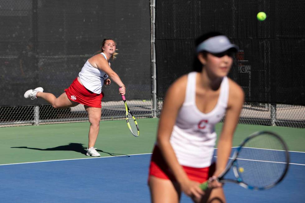 Coronado's Kaylen Heiss serves to Palo Verde on the court with her partner Sidra Wohlwend on We ...
