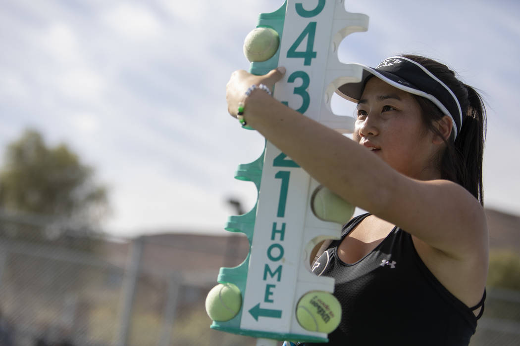 Palo Verde's Caroline Hsu updates the score during one of her doubles matches at the class 4A s ...