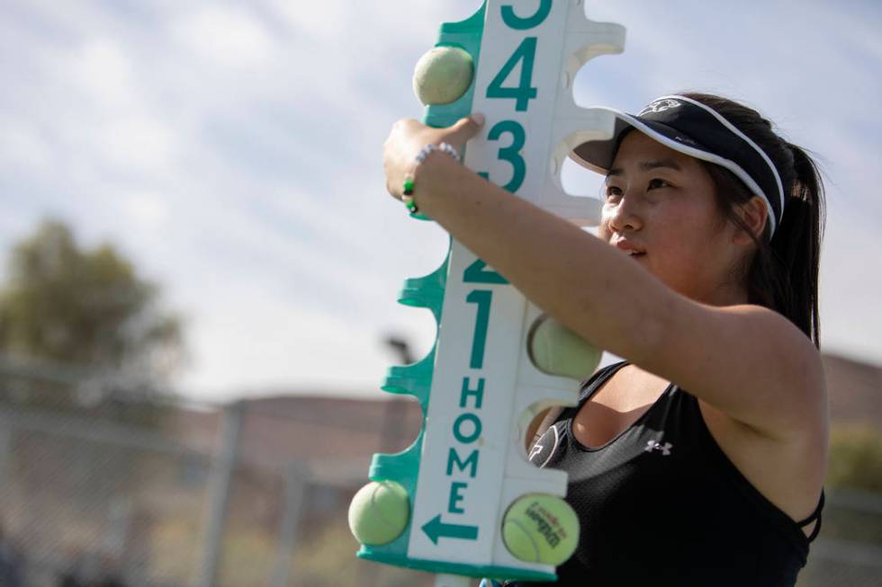 Palo Verde's Caroline Hsu updates the score during one of her doubles matches at the class 4A s ...
