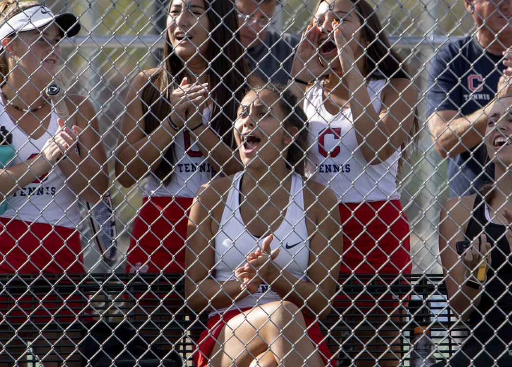 Coronado cheers on their teammates during a doubles match in the class 4A state championship on ...