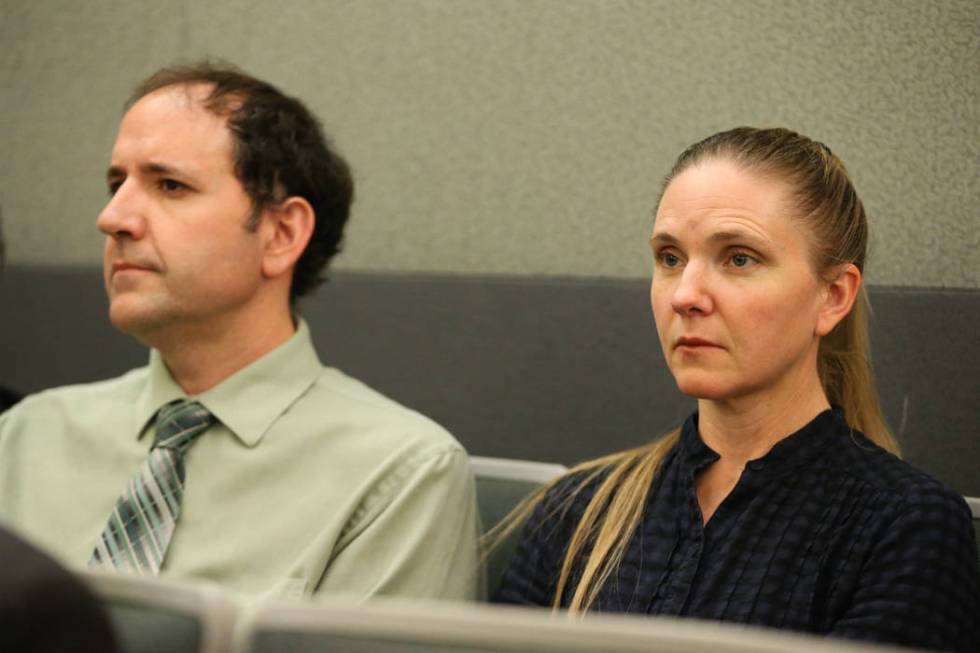 Sean Davis, left, and his wife, Kara, listen during a court hearing for Giovanni Ruiz, accused ...