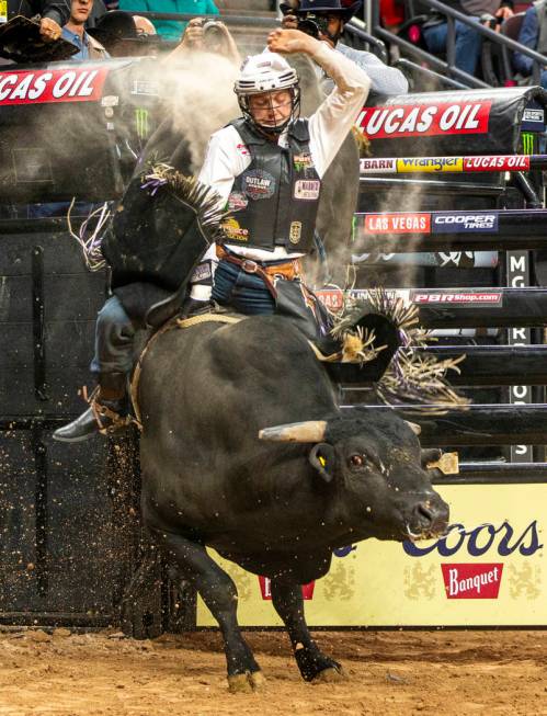 Mason Taylor rides El Big Bad for just under eight seconds during the PBR World Finals at T-Mob ...