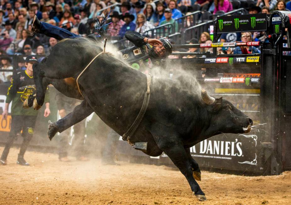 Luciano De Castro gets bucked off the side of Gangster Party during the PBR World Finals at T-M ...