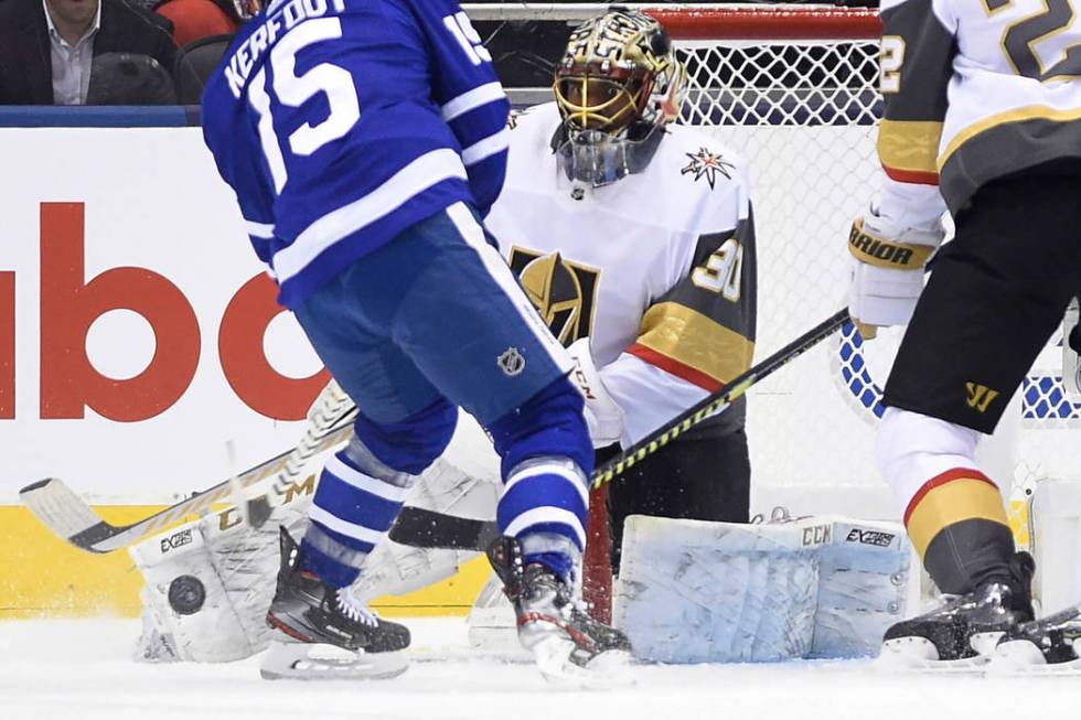 Vegas Golden Knights goaltender Malcolm Subban (30) makes a save on Toronto Maple Leafs center ...