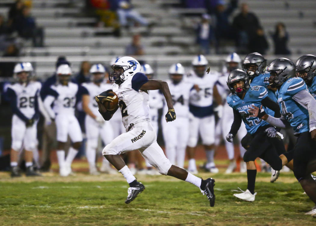 Foothill's Kendric Thomas (2) runs the ball past Silverado defenders during the second half of ...