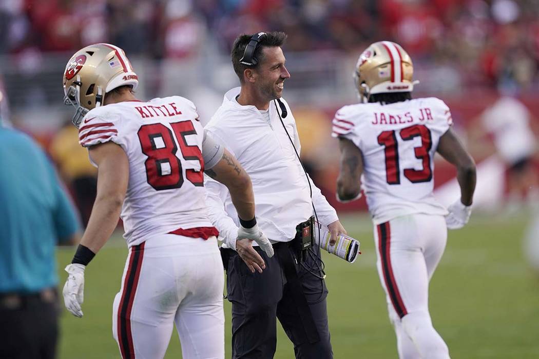 San Francisco 49ers head coach Kyle Shanahan greets tight end George Kittle (85) during the sec ...