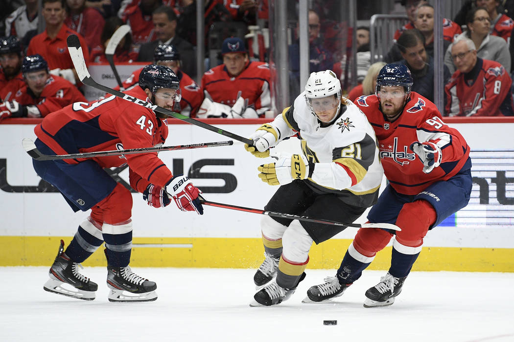 Washington Capitals center Lars Eller (20), of Denmark, and Vegas Golden Knights center Nicolas ...