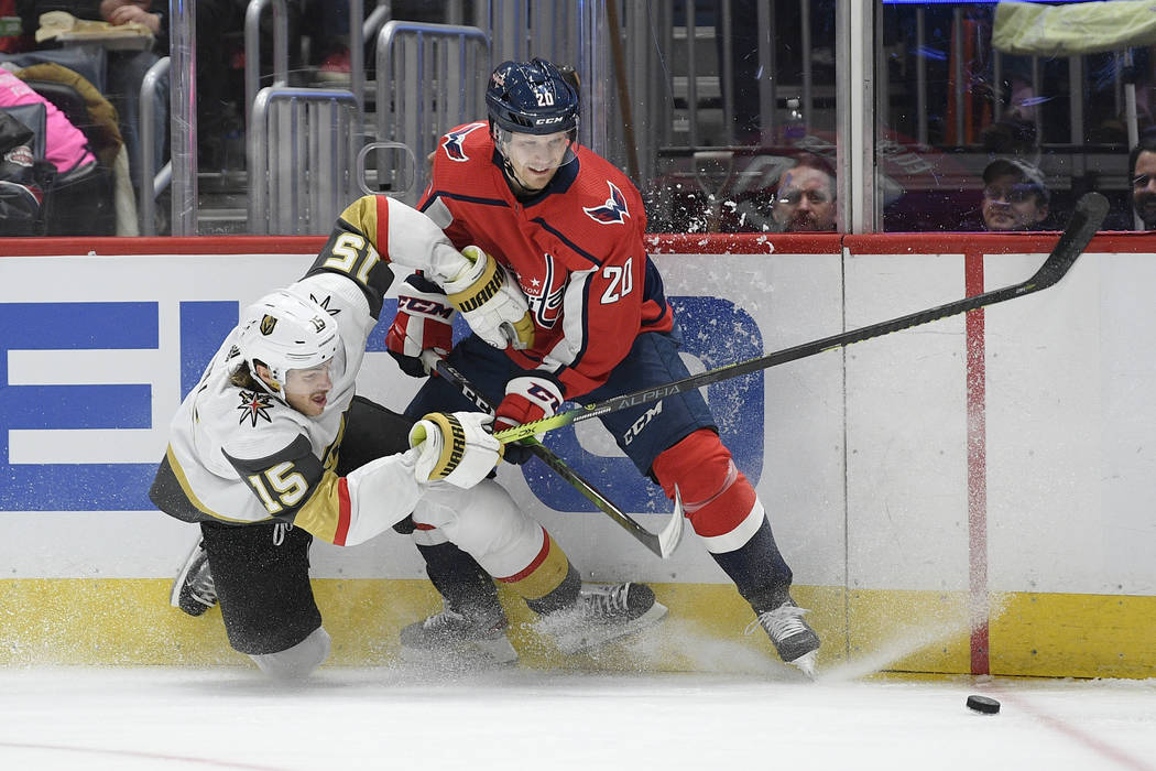 Washington Capitals center Lars Eller (20), of Denmark, and Vegas Golden Knights defenseman Jon ...