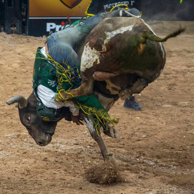 Keyshawn Whitehorse attempts to hang on to Rocket Man during the third day of the PBR World Fi ...