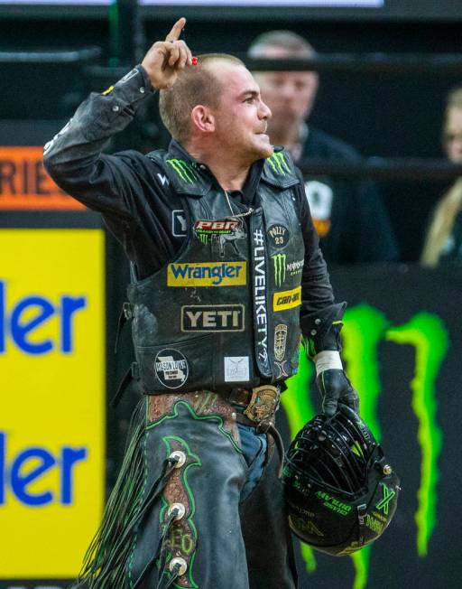 Chase Outlaw celebrates a successful ride on Catch My Drift during the fourth day of the PBR Wo ...