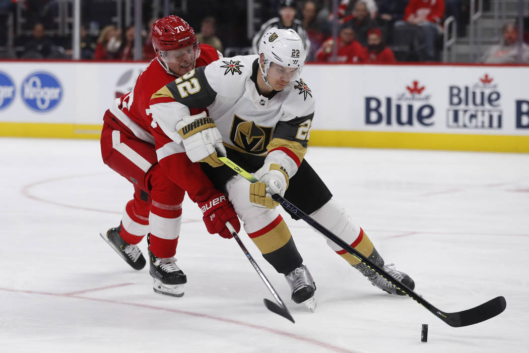 Detroit Red Wings center Christoffer Ehn (70) reaches in as Vegas Golden Knights defenseman Nic ...