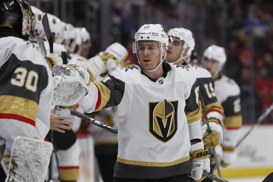 Vegas Golden Knights center Jonathan Marchessault greets teammates after scoring during the fir ...