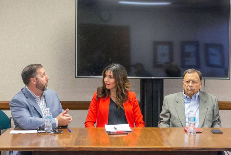 Las Vegas Bowl executive director John Saccenti, left, UNLV athletic director Desiree Reed-Fran ...