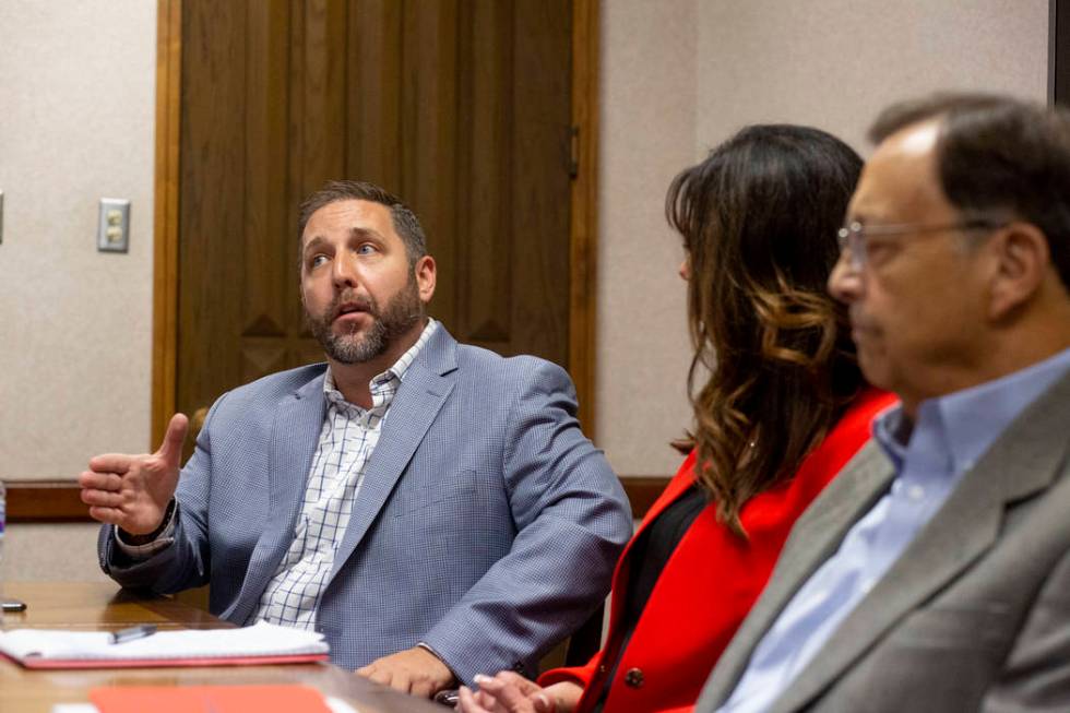 Las Vegas Bowl executive director John Saccenti, left, UNLV athletic director Desiree Reed-Fran ...