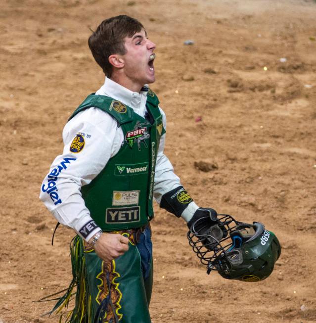 Jess Lockwood celebrates a successful ride on Rising Sun during the last day of the PBR World F ...