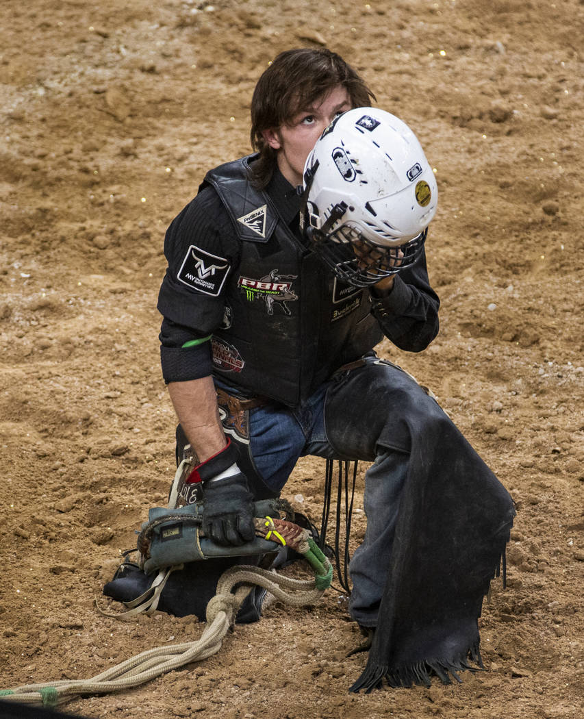 Dylan Smith gives thanks after escaping injury on Oz during the last day of the PBR World Final ...