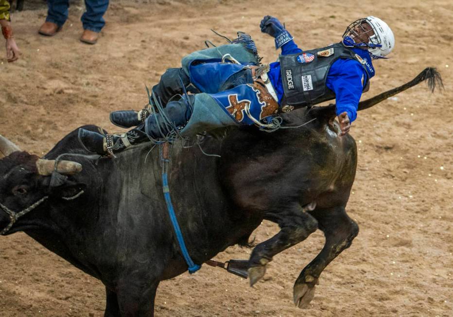 Ezekiel Mitchell is bucked back off of Medicine Man during the last day of the PBR World Final ...