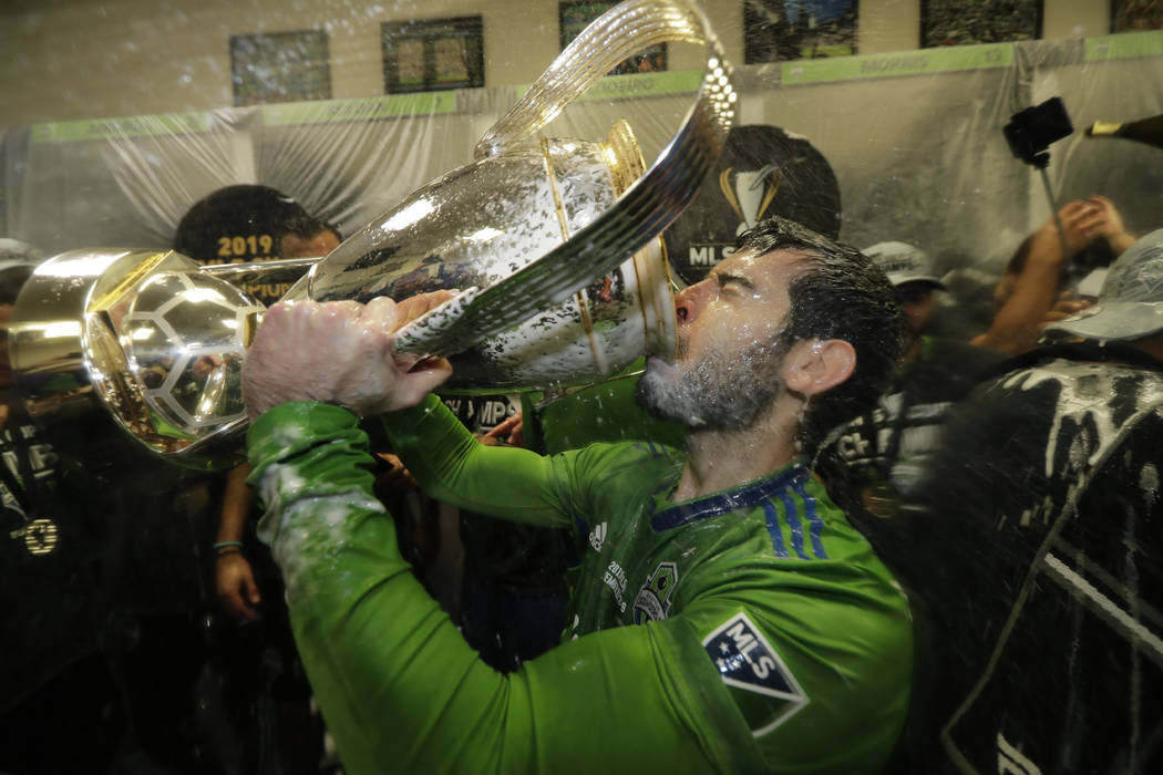 Seattle Sounders' Victor Rodriguez, who scored a goal in the match, drinks from the cup Sunday, ...