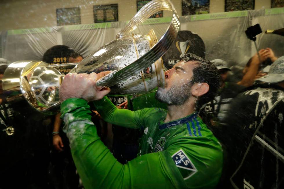 Seattle Sounders' Victor Rodriguez, who scored a goal in the match, drinks from the cup Sunday, ...