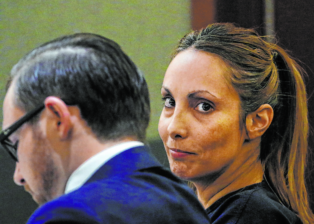 Alexis Plunkett, the jailed Las Vegas defense lawyer, appears in court with her defense attorne ...