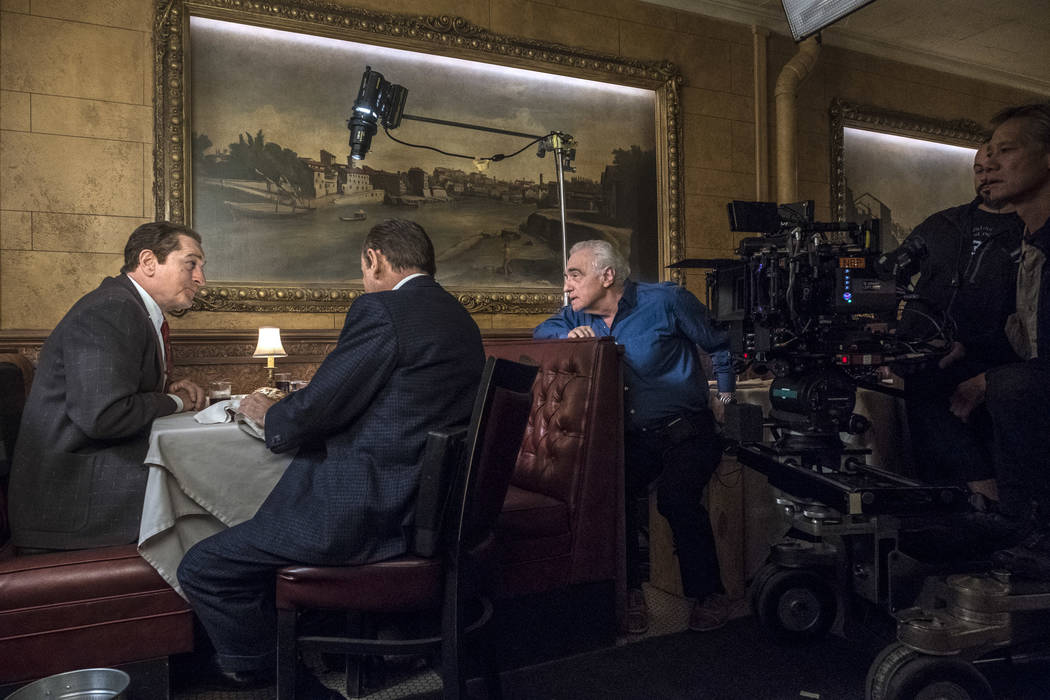 Martin Scorsese directs Robert De Niro and Joe Pesci in a scene from The Irishman. Photo Credit ...