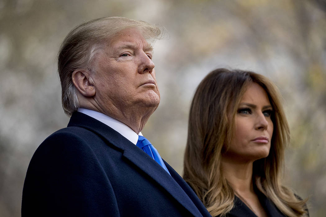 President Donald Trump and first lady Melania Trump participate in a wreath laying ceremony at ...