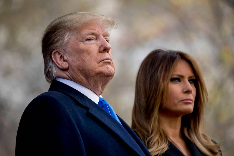 President Donald Trump and first lady Melania Trump participate in a wreath laying ceremony at ...