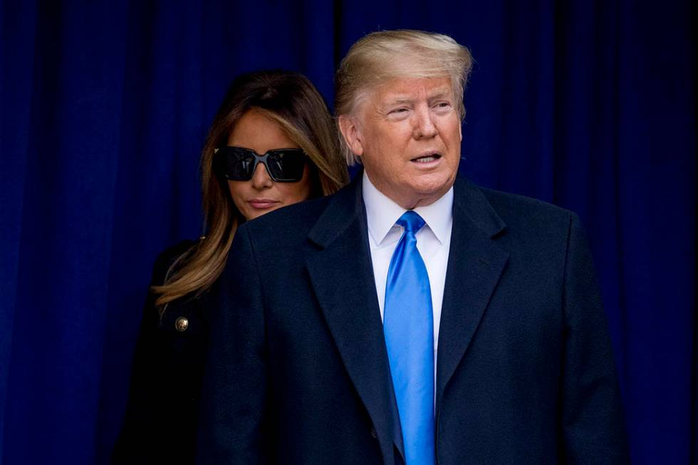 President Donald Trump and first lady Melania Trump arrive for a wreath laying ceremony at the ...