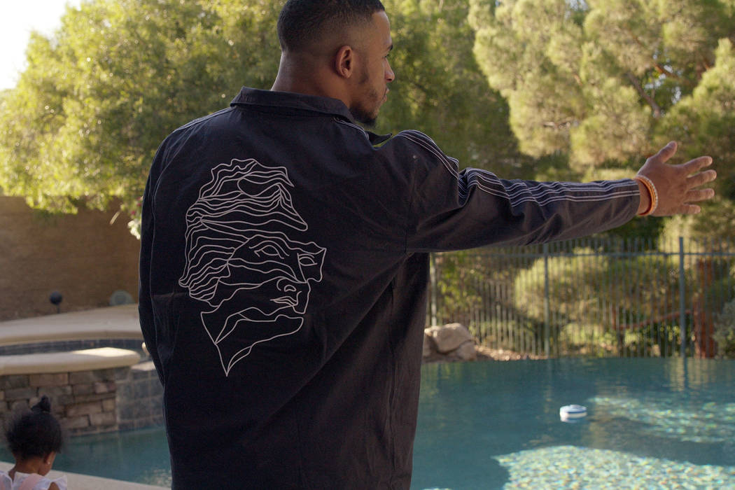 Raiders rookie safety Johnathan Abram takes a look at the pool and backyard of a home in the La ...