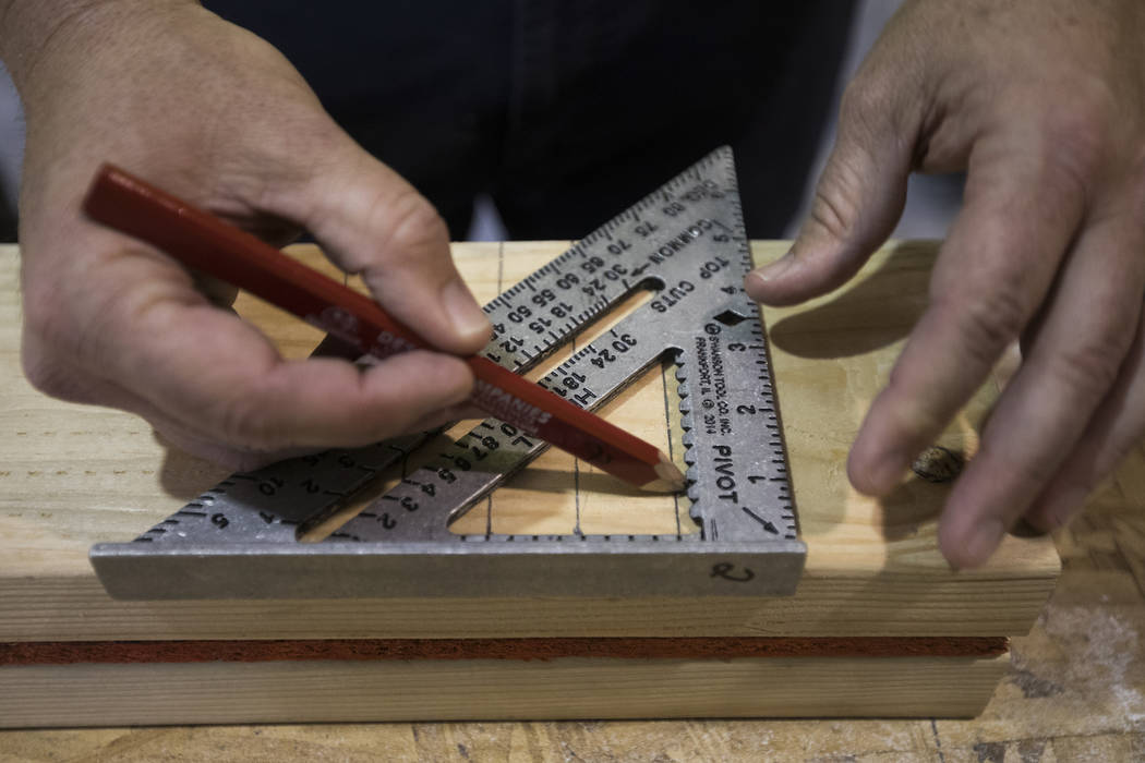 Kyle Tibbits teaches a framing class to homeless youth as part of HomeAid WORKS, a program that ...