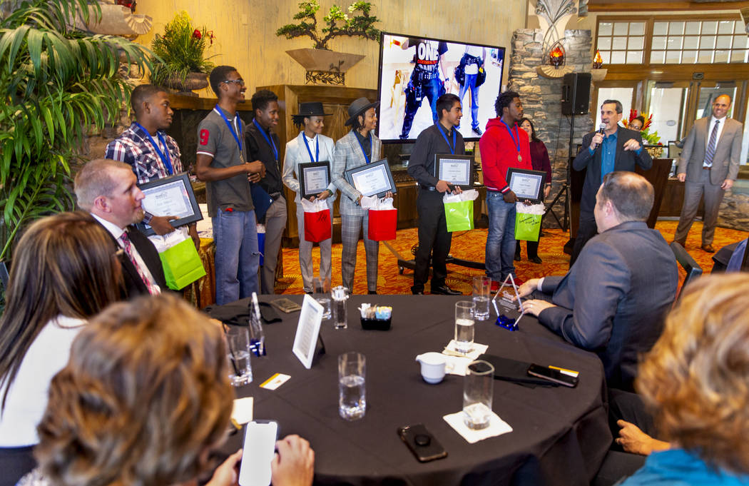 Members of the first graduating class of HomeAid WORKS are commended by Nat Hodgson of HomeAid ...