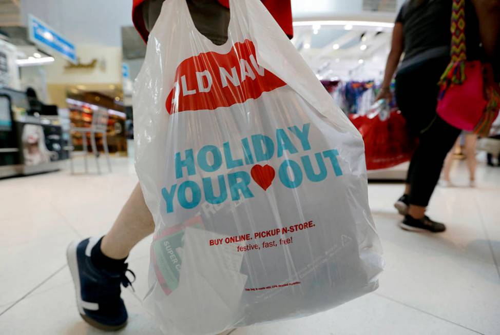 A Black Friday shopper walks through Dolphin Mall on Friday, Nov. 23, 2018, in Miami. (AP Photo ...