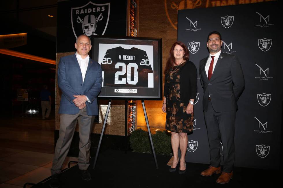 Raiders President Marc Badain, from left, Henderson Mayor Debra March and M Resort Vice Preside ...