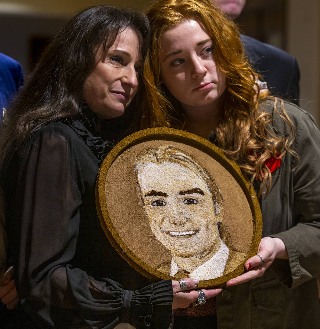 Carol, left, and Bentley Jimmerson pose with a floragraph of family member Jacob Jimmerson who ...