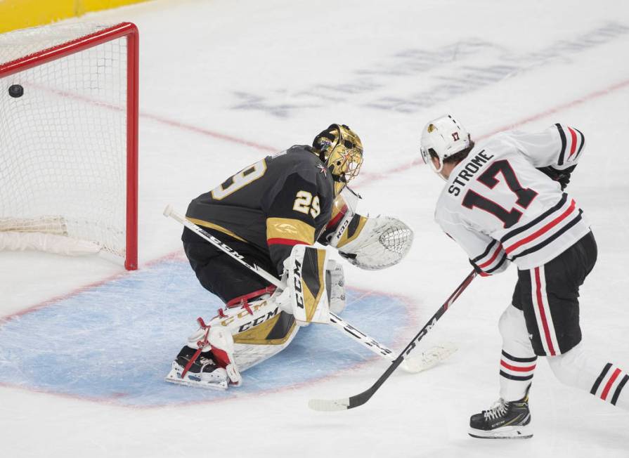 Chicago Blackhawks center Dylan Strome (17) scores on Vegas Golden Knights goaltender Marc-Andr ...