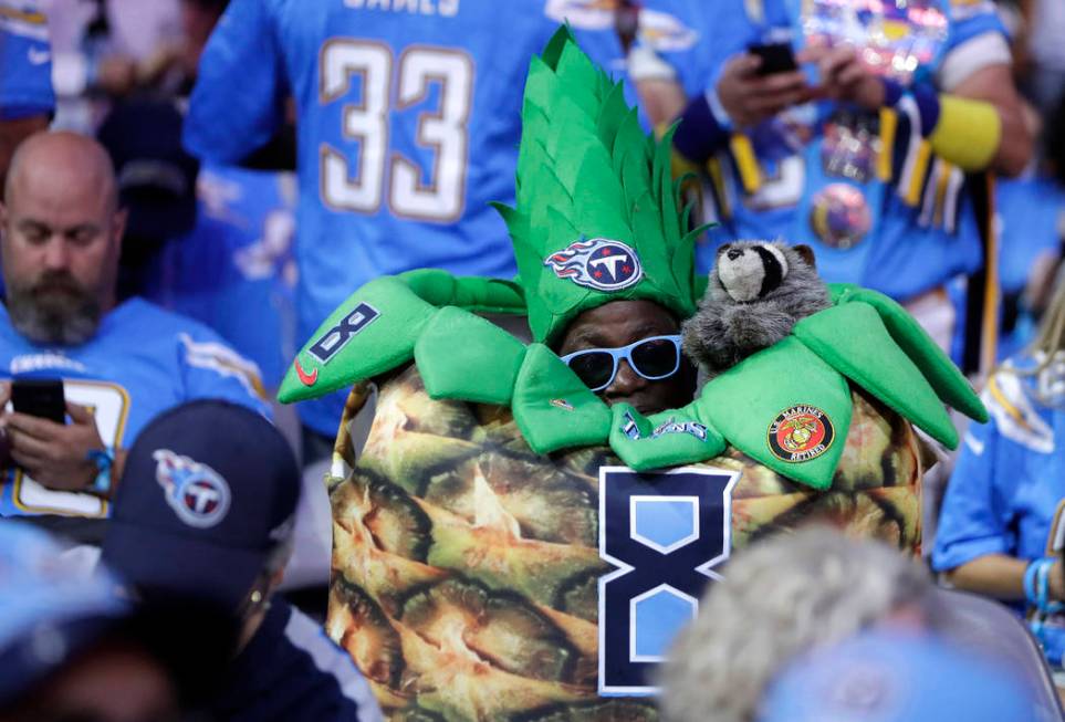 Tennessee Titans fans watch activity on the main stage during the first round at the NFL footba ...