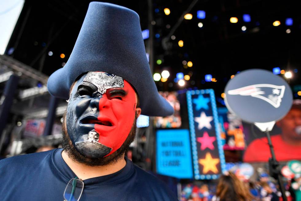 New England Patriots fan Derek Breton, of Huntsville, Ala., stands on the main stage ahead of t ...