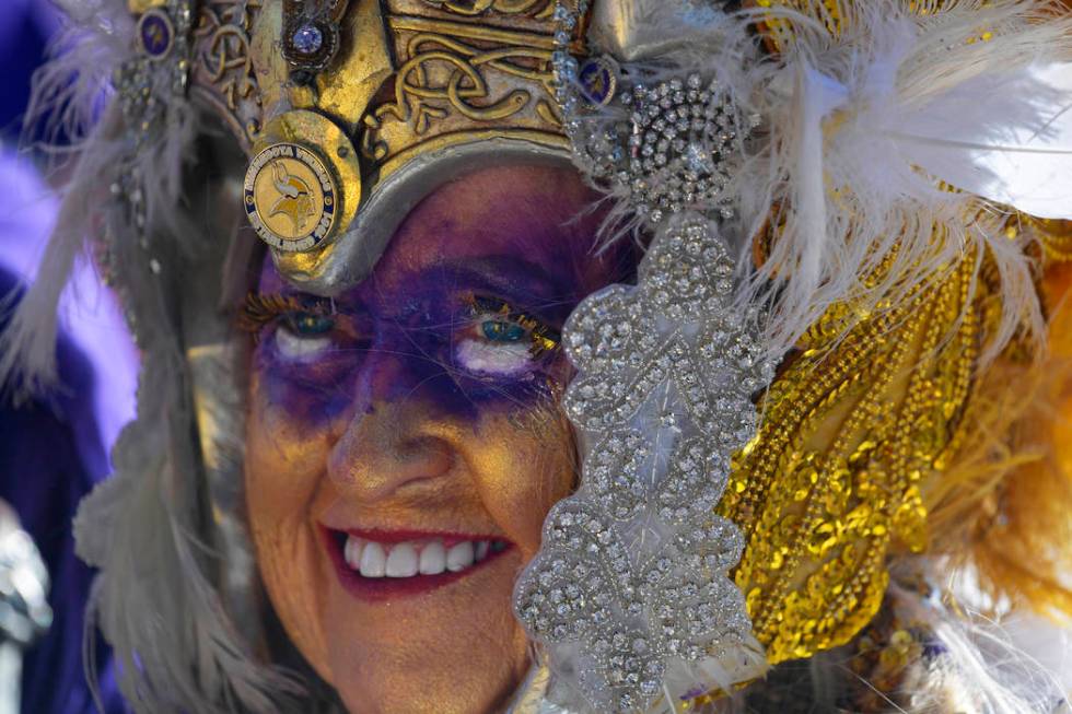 Minnesota Vikings fan Carol Jensen, of Austin, Minn., stands near the main stage ahead of the s ...