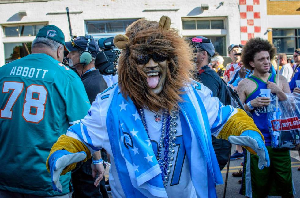 Detroit Lions fan Aaron Latimer from Saginaw, Michigan supports his team during the NFL Draft, ...