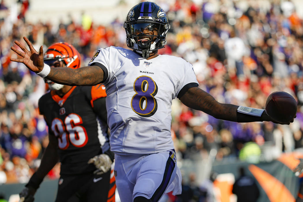 Baltimore Ravens quarterback Lamar Jackson (8) celebrates his touchdown during the second half ...