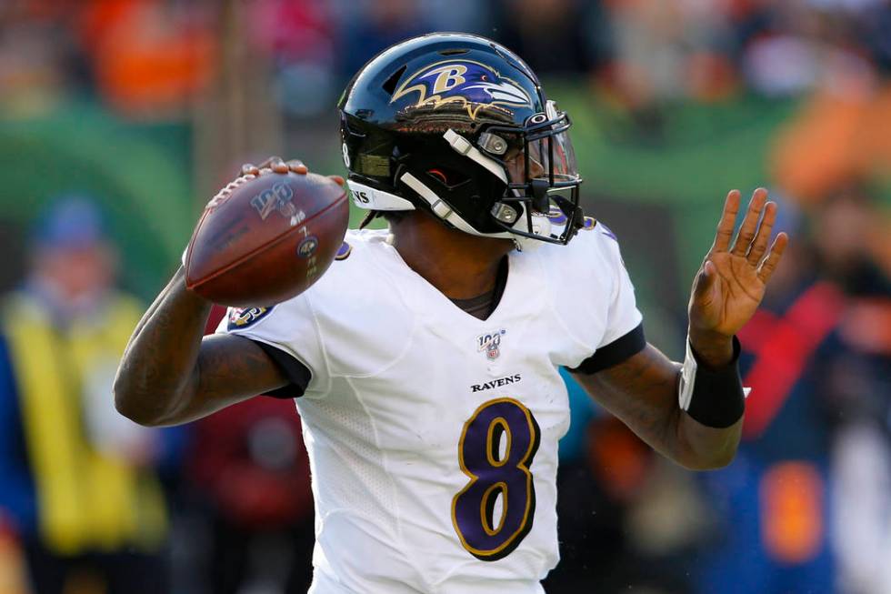 Baltimore Ravens quarterback Lamar Jackson passes during the second half of NFL football game a ...