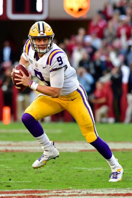 LSU quarterback Joe Burrow (9) looks for an open receiver in the first half of an NCAA football ...