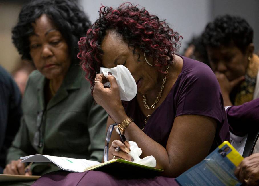 Sonja Mason, center, Tyrone Thompson's sister, is comforted by her aunt Bea Soares, left, at th ...
